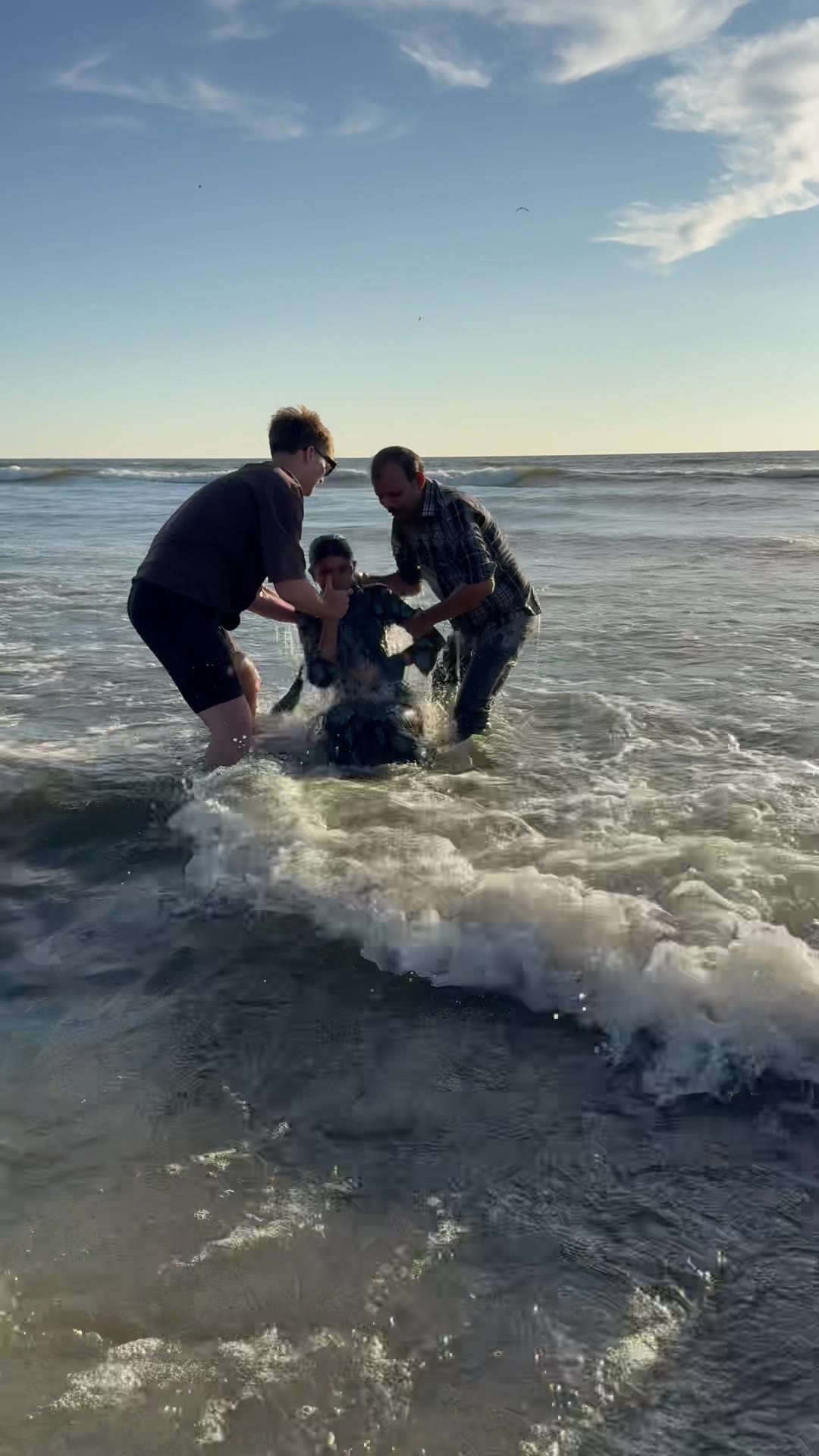A new believer baptized in the sea