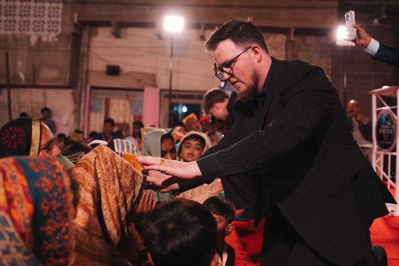 Reaching out to pray for women at the front of the crusade